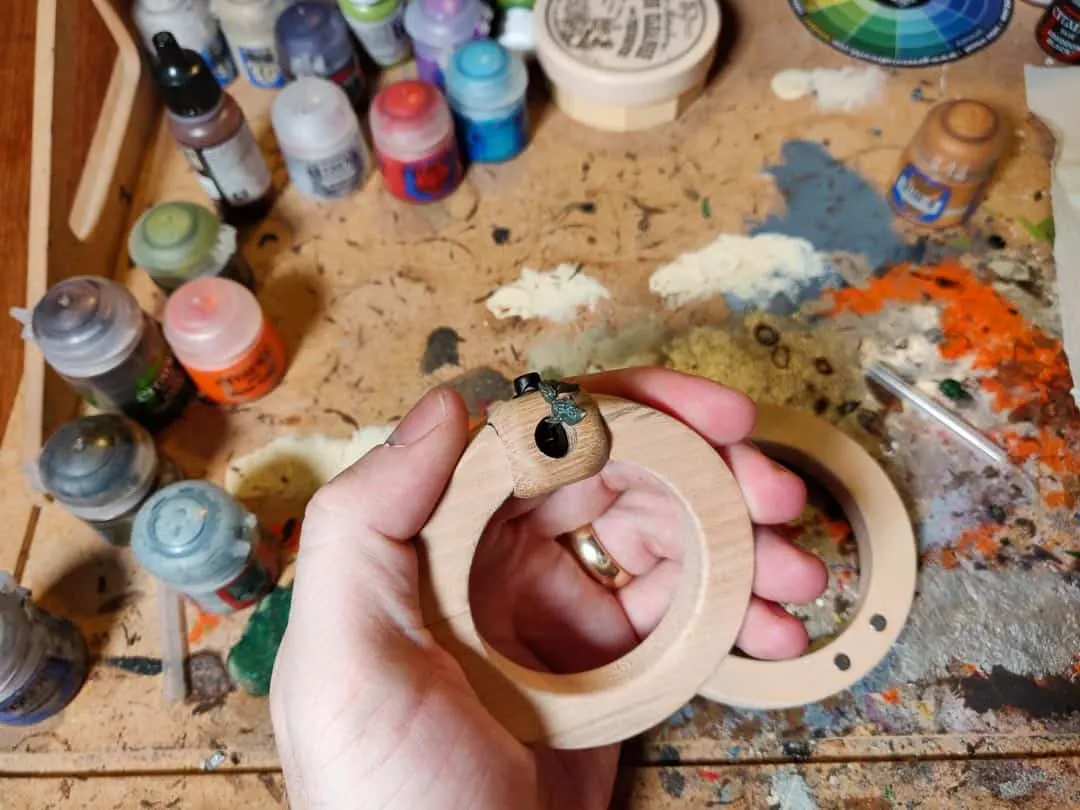 Me holding the jig to show how comfortable painting faces can be