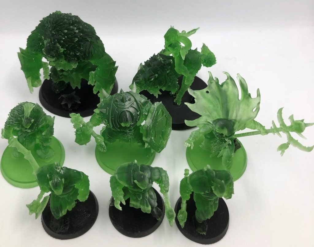 A Black Orcs warband just printed just printed from a resin 3D printer in green resin