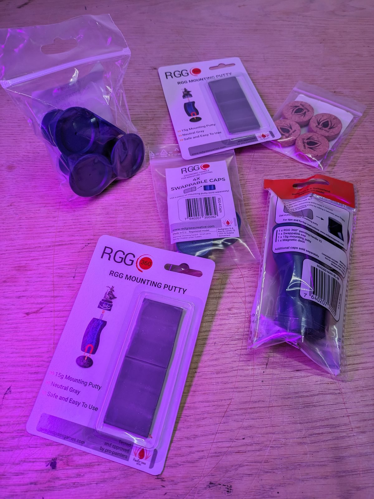 RGG360 painting handle, RGG Mounting Putty and swappable caps from Redgrass Games